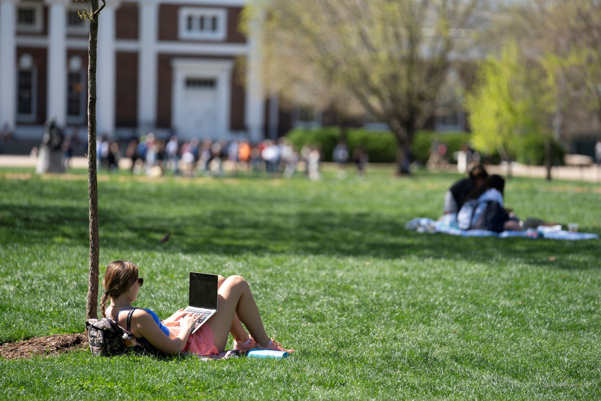 Student outside on laptop