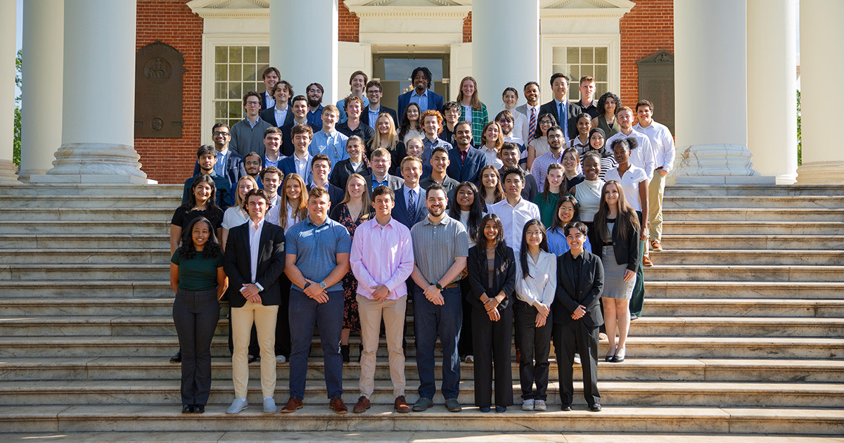 A group photo of the M.S. in Data Science residential cohort Class of 2025 standing on the steps of UVA's Rotunda.