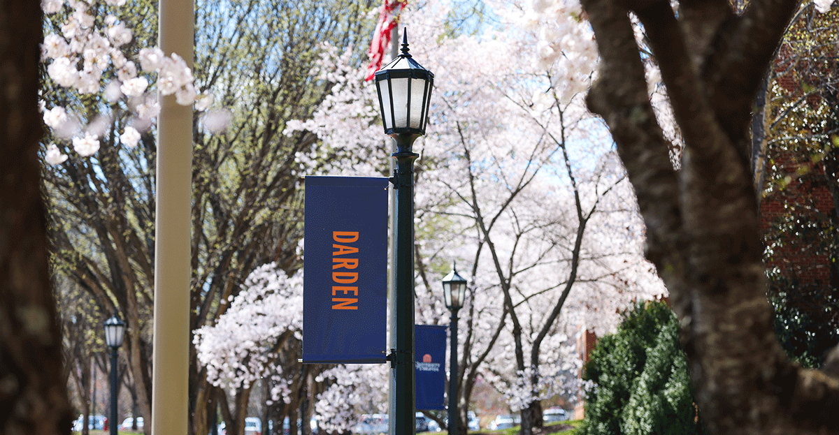 A pole mounted street light featuring a sign that reads 