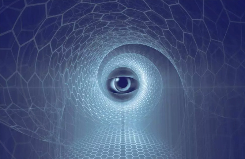 A human eye in the center of a blue hexagon grid.