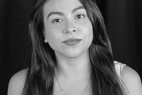 Black and white head shot of Anneleise Azua